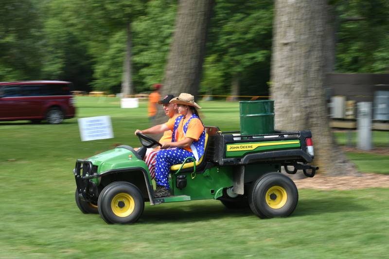 DeKalb park district employees Michael Kocher, of Sycamore (driver), and Dave Klenke, of DeKalb, are just a few of the employees who made sure the park was clean during the Fourth of July celebration at Hopkins Park in DeKalb on Thursday, July 4, 2024.