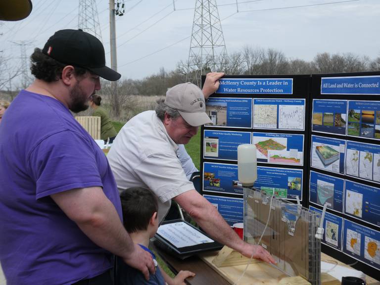 McHenry County water resource specialist Scott Kuykendall, center, presents on groundwater resources at the Earth Day Celebration at Prairieview Education Center on April 23, 2022.