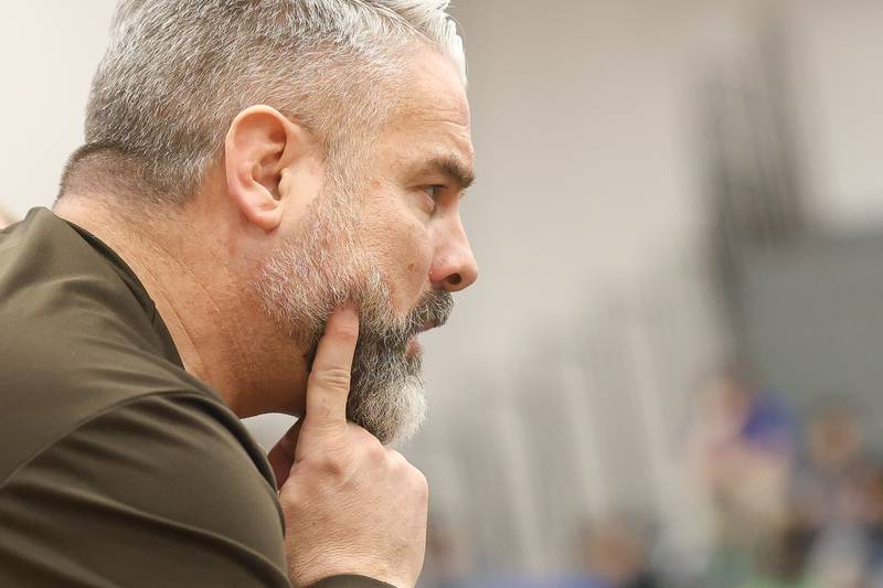 Joliet Catholic head coach Ryan Cumbee watches Joliet Catholic’s Jason Hampton and Minooka’s Maddux Tindal in the Class 3A Minooka Regional 132 pound championship  match on Saturday, Jan. 31, 2026 in Minooka.