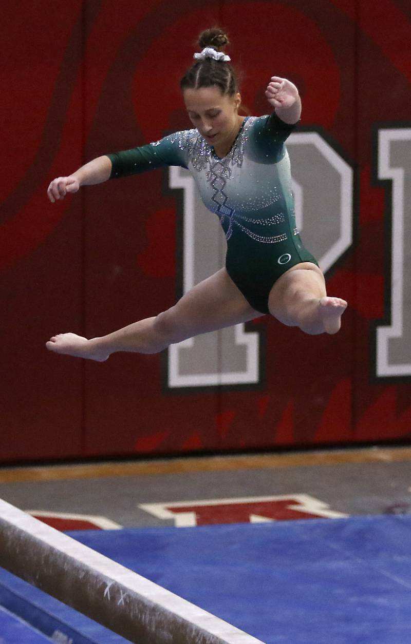 Glenbard West's Samantha Hopper competes in the preliminary round of the balance beam Friday, Feb. 17, 2023, during the IHSA Girls State Final Gymnastics Meet at Palatine High School.