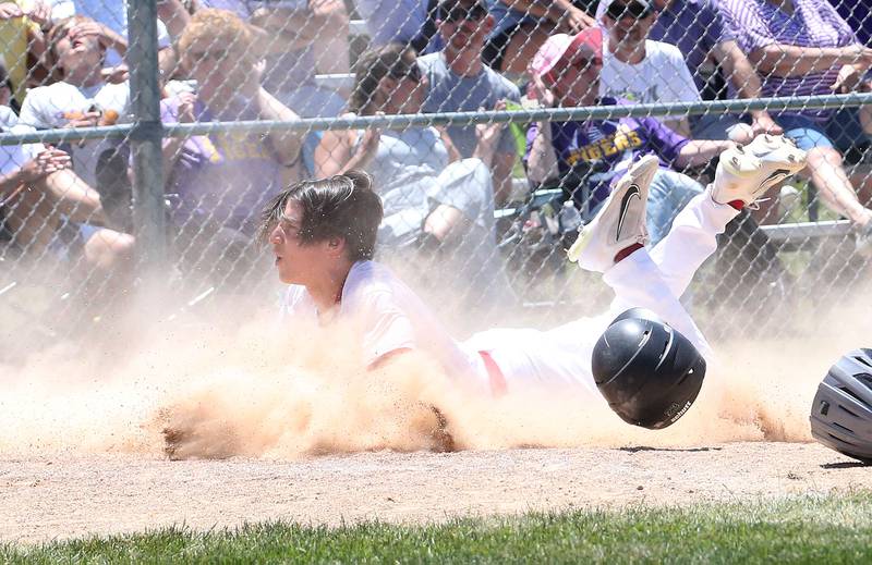 Hall's Jack Curran slides into home to score a run against Sherrard during the Class 2A Sectional final game on Saturday, May 27, 2023 at Knoxville High School.