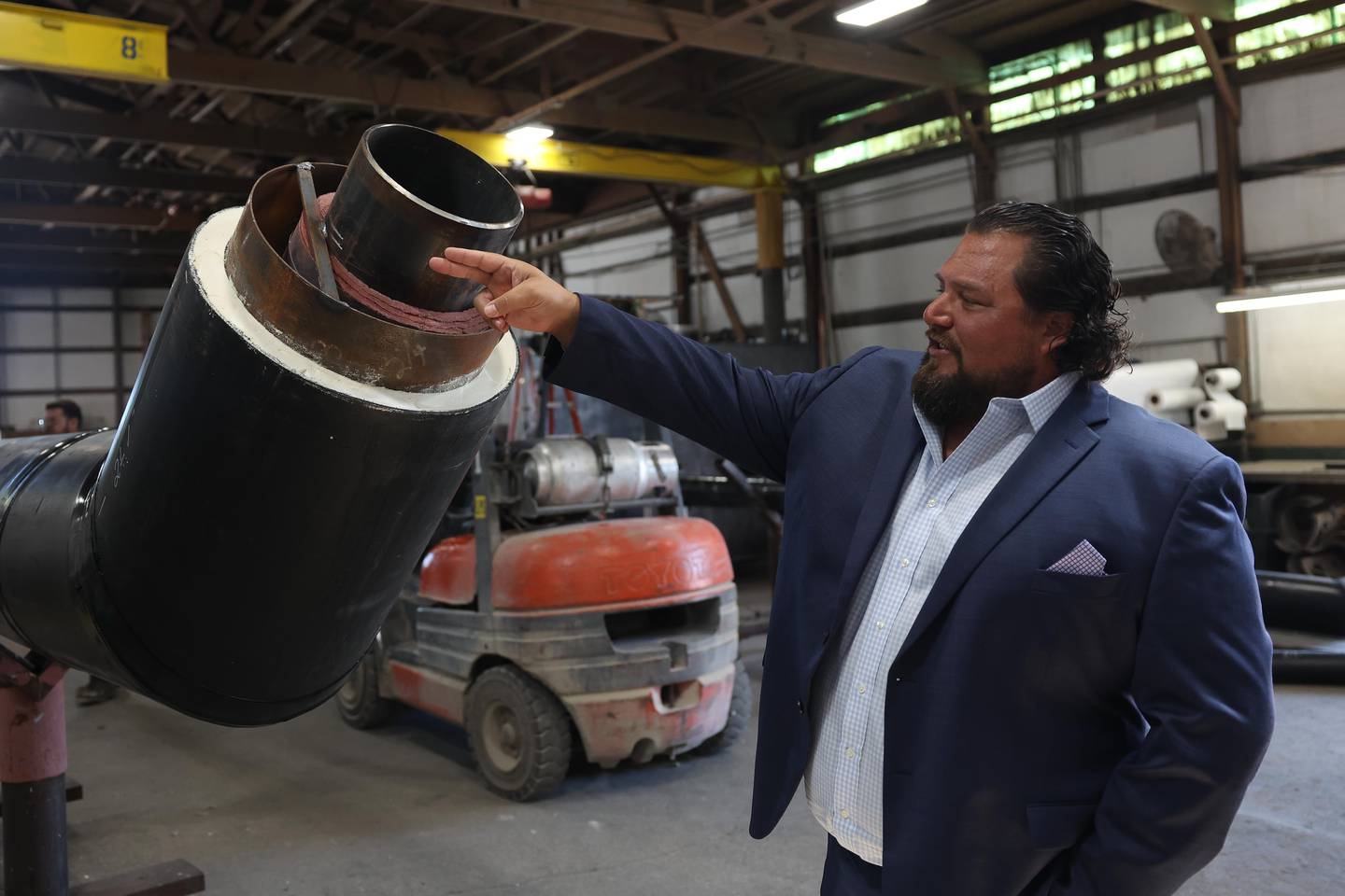 Rovanco Piping Systems owner Chad Godeaux talks about the company’s pre-engineered pipes on Wednesday, Sept. 4, 2024 in Joliet.