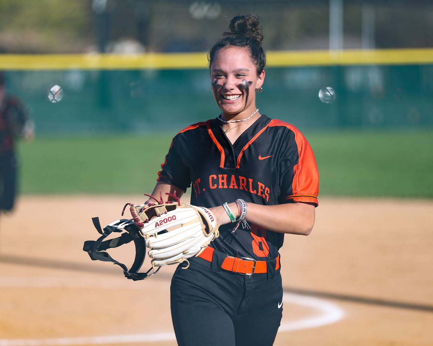 St Charles East's Grace Hautzinger (8) runs off he field after getting an out during varsity softball game between St Charles East at Downers Grove South.  April 12, 2023.