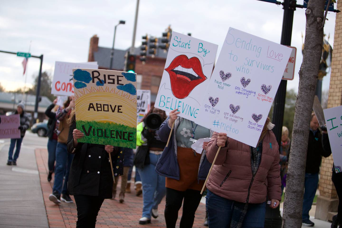 Supporters come together for Safe Passage's Take Back The Night March downtown on Monday April 17,2023 in DeKalb.