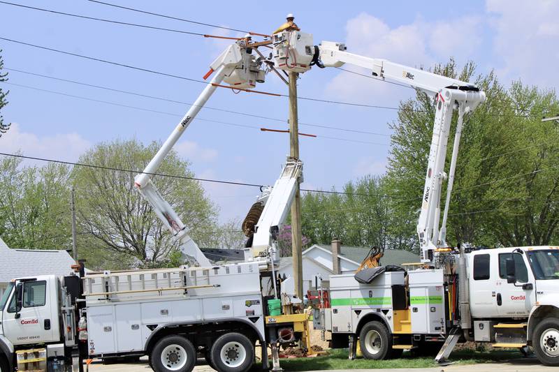 Bucket trucks from ComEd are at work installing power lines that will serve the Dixon Park District community center and headquarters at The Meadows.
