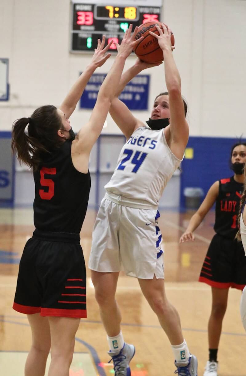 Princeton's McKenzie Hecht takes aim against Hall's Promise Giacometti Monday night at Prouty Gym. The Tigresses rallied for a 40-32 victory.