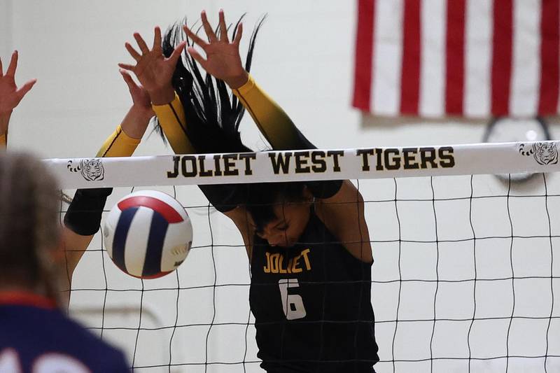 Joliet West’s Faith Jordan blocks a shot for the point against Romeoville on Thursday, Sept. 5, 2024 in Joliet.