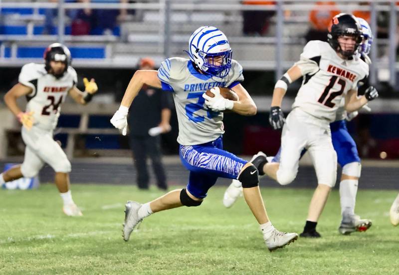 Princeton''s Ayden Agushi races for an 88-yard kickoff return in Friday's game vs. Kewanee at Bryant Field. The Tigers won 63-12.