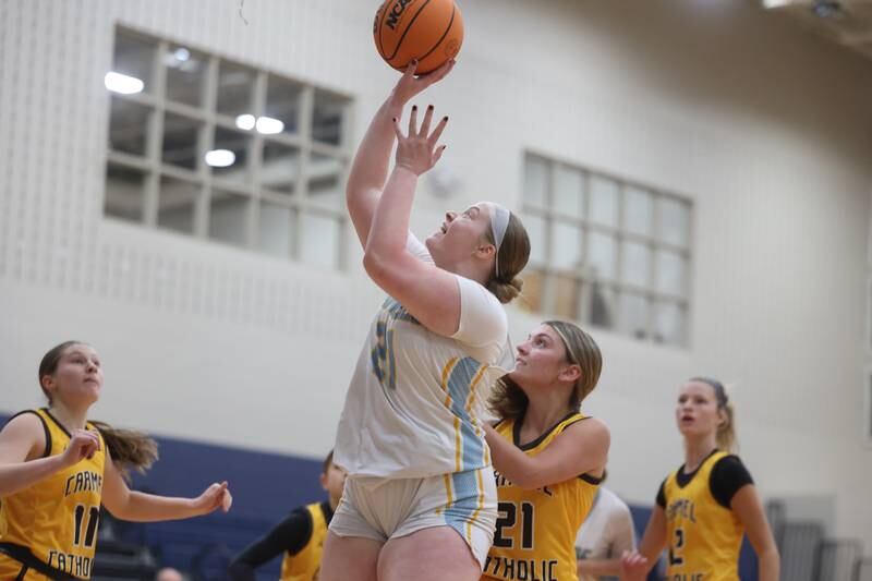 Joliet Catholic’s Emma Birsa gets the easy basket against Carmel on Wednesday, Jan 15, 2025 in Joliet.