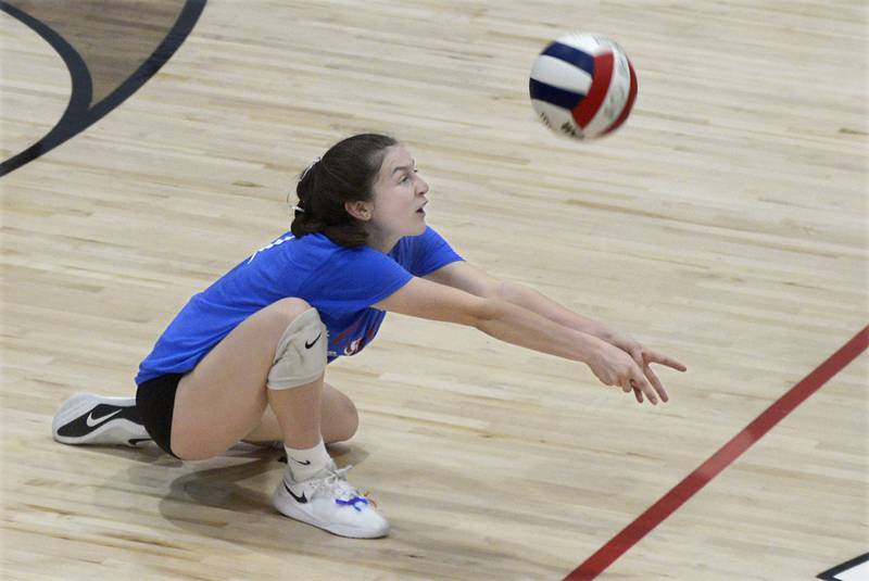 Woodland libero Kaiden Connor digs a Serena attack during the second set Tuesday, Sept. 5, 2023, at Woodland.