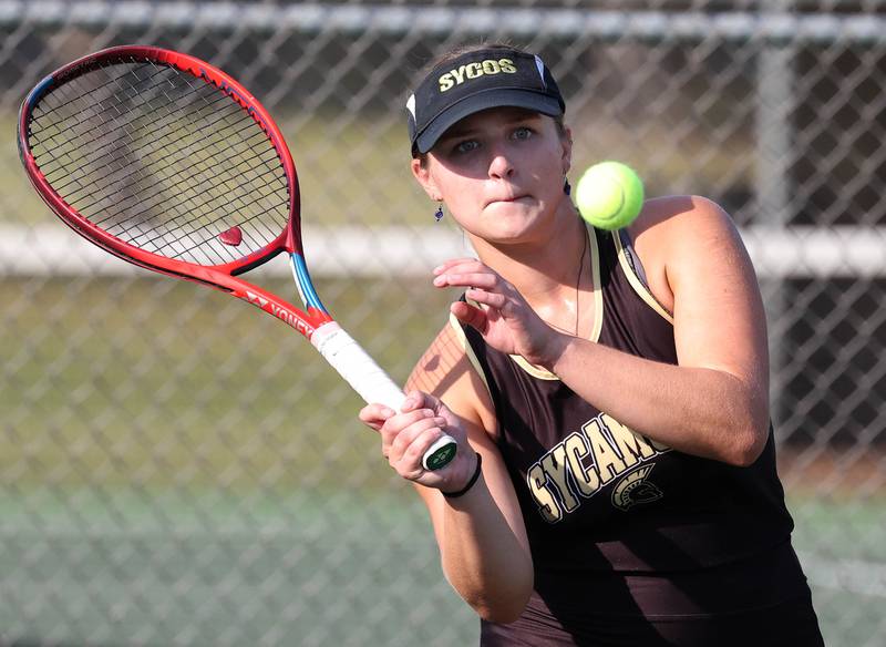 Sycamore’s Maggie Klein keeps her eye on the ball during her doubles match against DeKalb Wednesday, Sept. 18, 2024, at Sycamore High School.