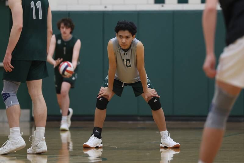 Plainfield Central’s Craven Andaya waits as teammate Owen Pehle readies to serve against Joliet West on Tuesday, April 23, 2024 in Plainfield.