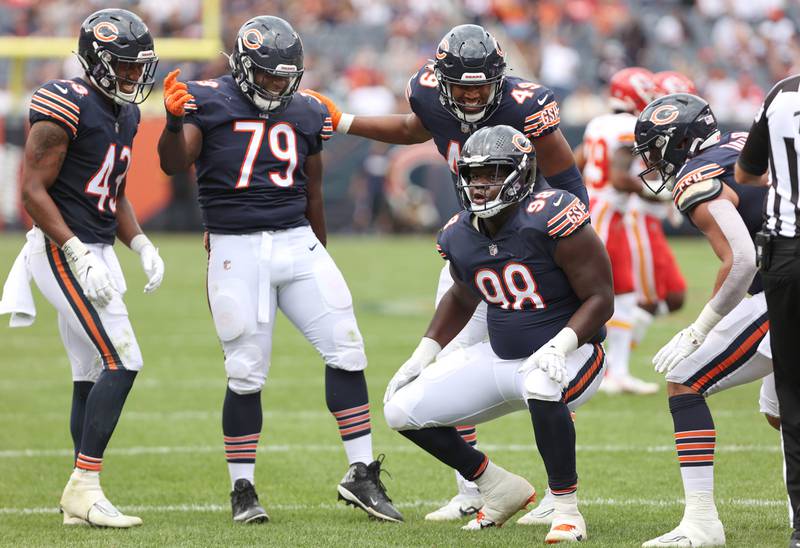 The Chicago Bears defense celebrates after stopping the Kansas City Chiefs on 4th down late in the 4th quarter during their preseason game Sunday, Aug. 13, 2022, at Soldier Field in Chicago.