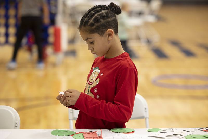 Remington Deatherage, 7, puts together a craft wreath Monday, Dec. 16, 2024, during Dixon Park District’s Cookies with Santa event at The Facility.