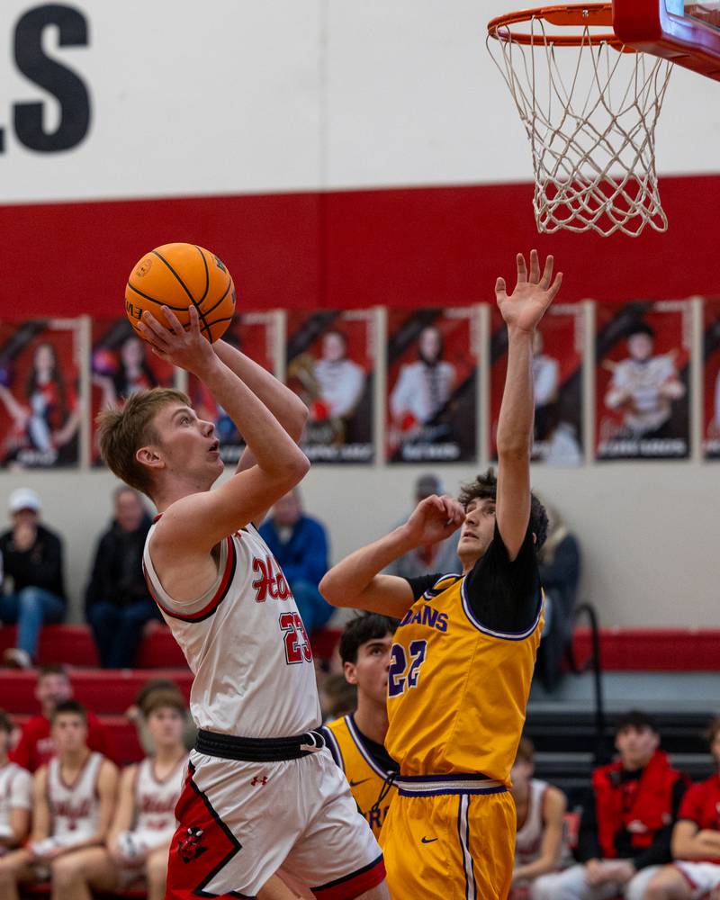 Chevy Langham (23) of Hall lays ball up as Carter Wujek (22) of Mendota jumps in defense during the championship game of the Colmone Classic on Saturday, December 20, 2025 at Hall High School in Spring Valley.