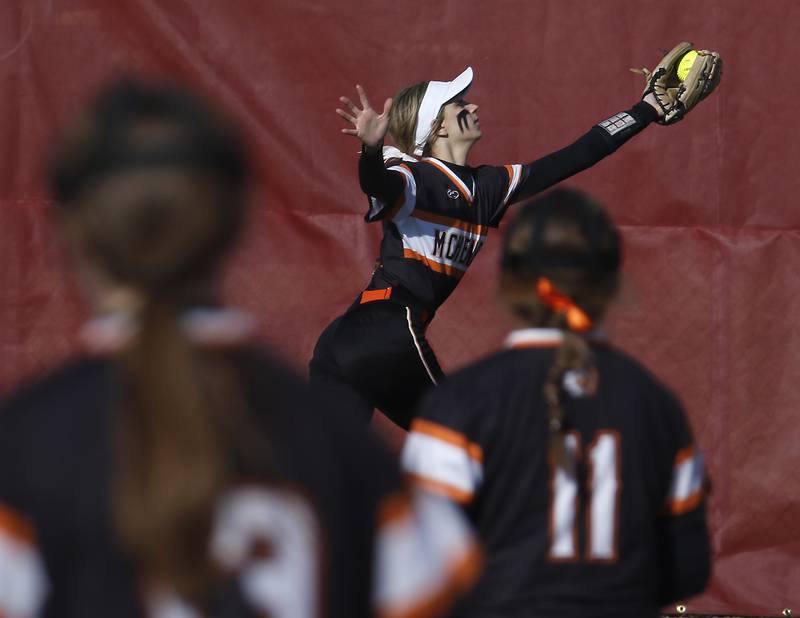 McHenry’s Jadyn Polerecky catches a long fly ball during a non-conference softball game Friday, April 1, 2022, between McHenry and Barrington at Barrington High School.