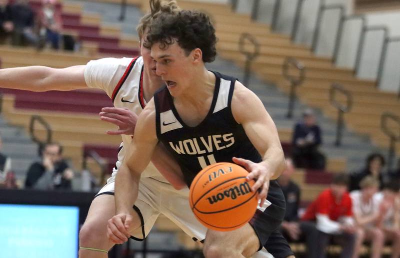 Prairie Ridge’s Luke Vanderwiel drives with the ball in varsity boys basketball on Tuesday, Feb. 18, 2025, at  Huntley High School in Huntley.