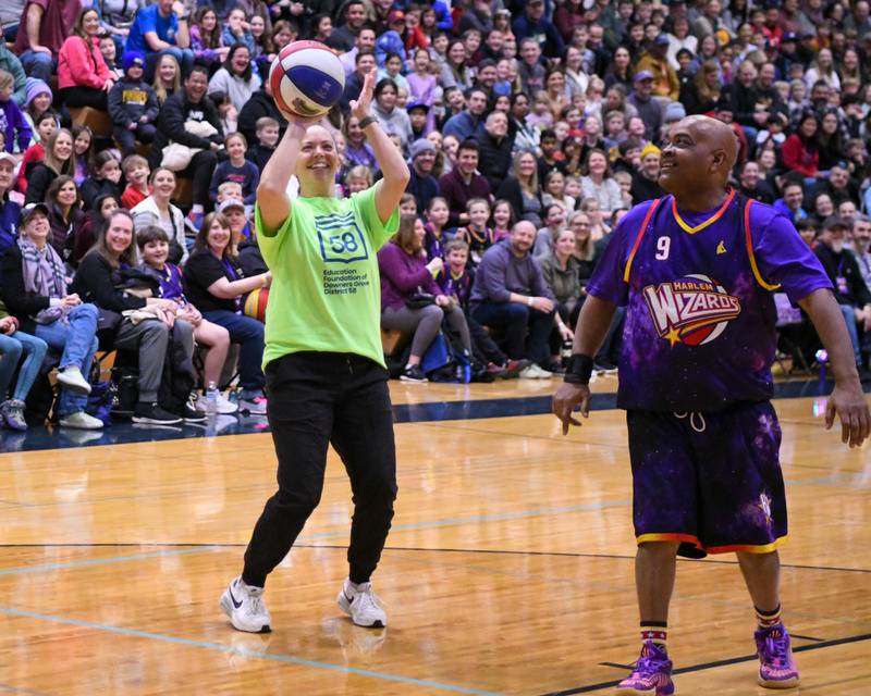 Whitney Cavanagh shoots the all on Sunday Jan. 19, 2025, while playing against The Harlem wizards held at Downers Grove South High School.
