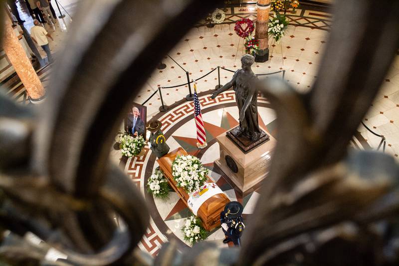 Former Gov. Jim Edgar lies in state in the Capitol rotunda, as pictured through an ornate railing on the second floor of the Statehouse.