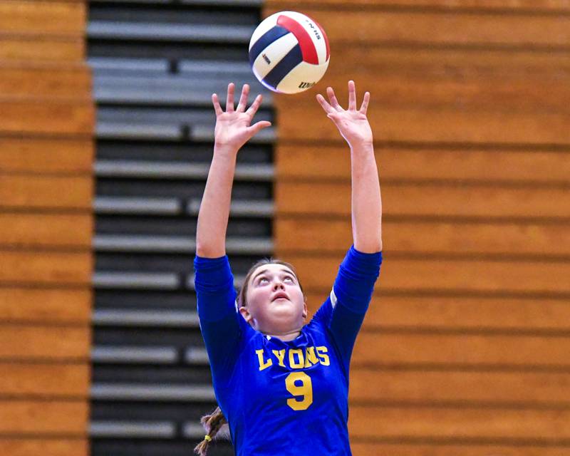 Lyons Township's Colleen Chambers (9) sets the ball during the regional title game against York on Thursday Oct. 30, 2025, held at York High School.