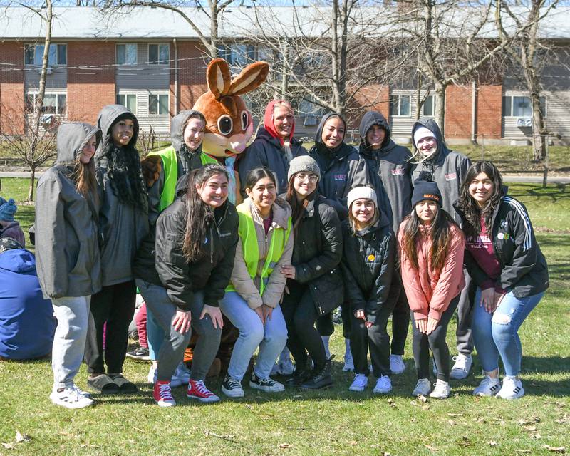 Volunteers pose with the Easter Bunny after the DeKalb Park District's annual children's egg hunt at Hopkins Park, 1403 Sycamore Road in DeKalb on Saturday, March 23, 2024.