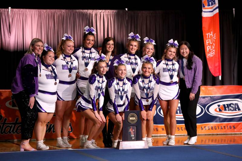 Members of the Wilmington cheerleading team celebrate their third-place finish in the small team division of the IHSA State Finals on Saturday, Feb. 8, 2025 at Grossinger Motors Arena in Bloomington.