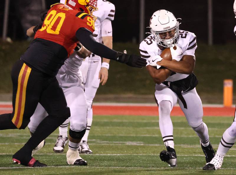 Mt. Carmel's Madden Wilson gets by Batavia's Gavin Pecor during their Class 8A state championship game Saturday, Nov. 30, 2024, in Hancock Stadium at Illinois State University in Normal.