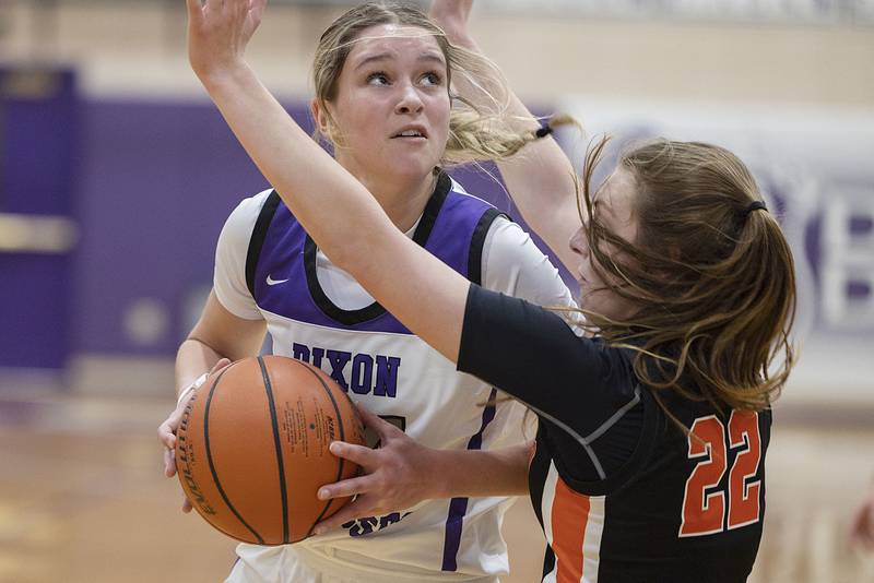 Dixon’s Ella Govig works below the basket against against Winnebago’s Madylin DiPizza Monday, Jan. 9, 2023.