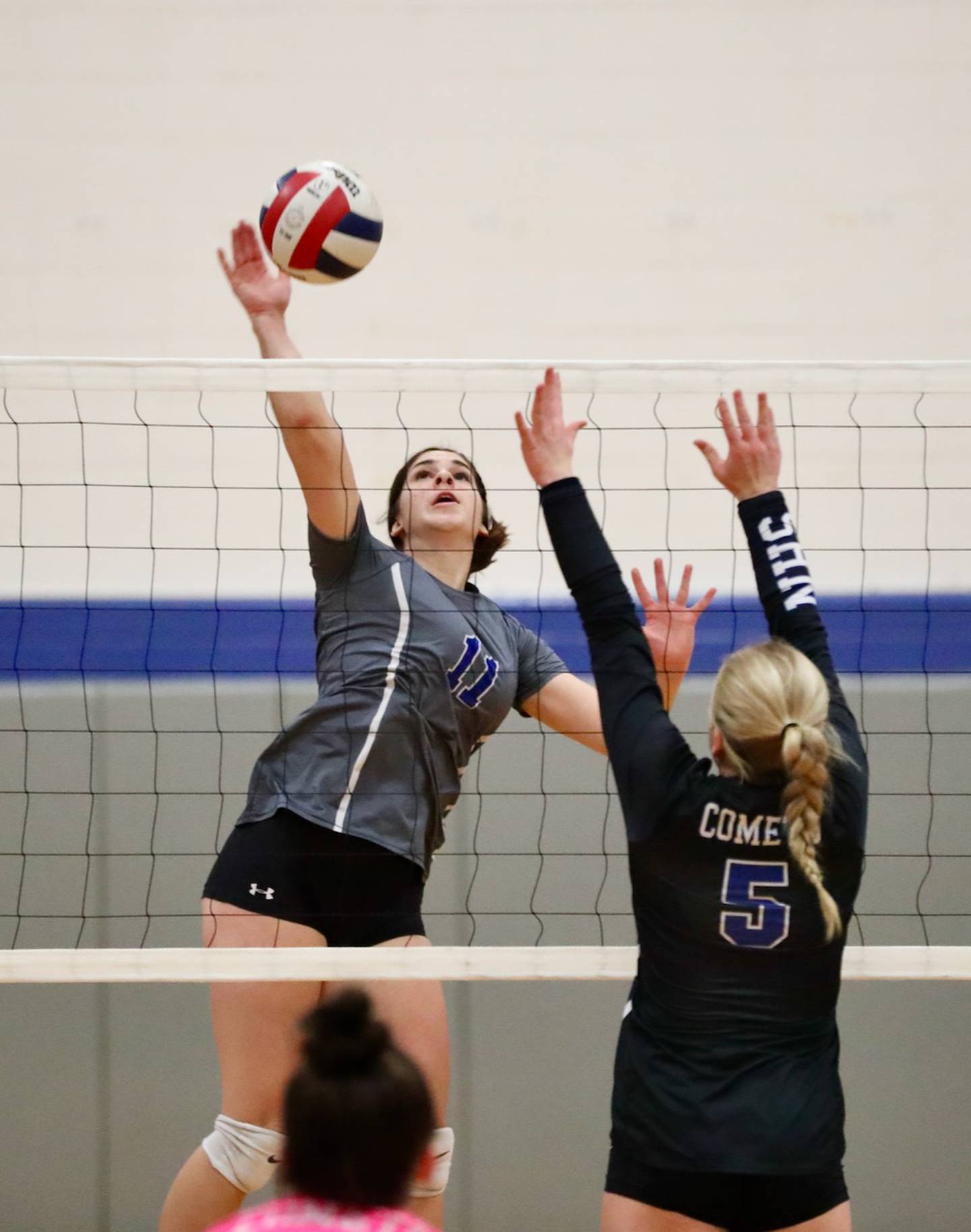Princeton's Olivia Gartin loads up against Newman's Molly Olson Thursday night at Prouty Gym.