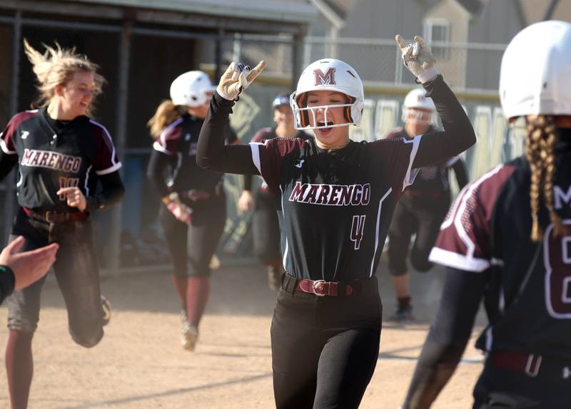 Marengo's Josephine Christiansen crosses the plate on teammate Gabby Christopher’s second home run of the day Friday, April 11, 2025, during their game at Sycamore High School.