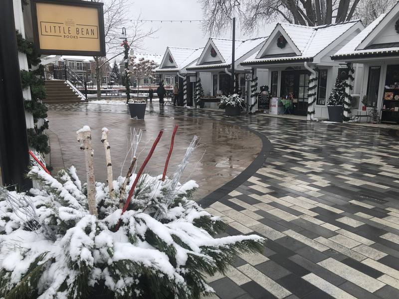 Shoppers came out to the McHenry Riverwalk Shoppes on Sunday, Nov, 26, 2023, despite the snow coming down. The shoppes will remain open Friday through Sunday until Dec. 31.