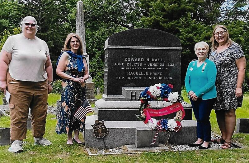 Attending this year's Patriot Remembrance ceremony were three descendants of Edward H. Hall, Bunnie Bowen, Kansas, her sister Beth Kalkman, Iowa, and their cousin Laurie Adams, Central Illinois. Pictured are (from left) Bunnie Bowen, Laurie Adams, Nancy Gartner, chapter Regent, and Beth Kalkman.
