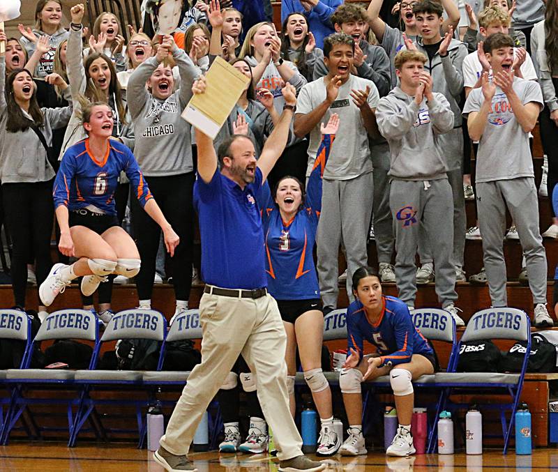 Genoa-Kingston's head coach Keith Foster reacts after his team wins the first set over Quincy Notre Dame in the Class 2A Supersectional volleyball game on Friday, Nov. 4, 2022 at Princeton High School.