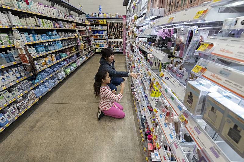 Aliza Lee, 10, and Liz Engstrom pick out glitter nail polish and other fun make-up options Saturday, Dec. 9, 2023 as part of the Sterling police Shop with a Cop. Fifteen kids were chosen to participate in the program.