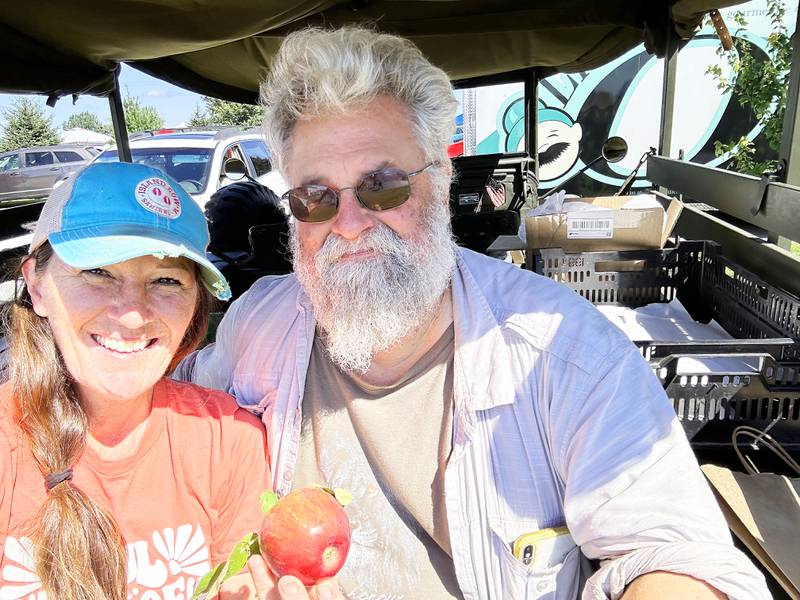 Lisa and John Ayers own Nomia Meadows Farm north of Franklin Grove, where they preserve 110 acres of prairie, grow apples in an orchard and collect and sell honey from bees they raise.