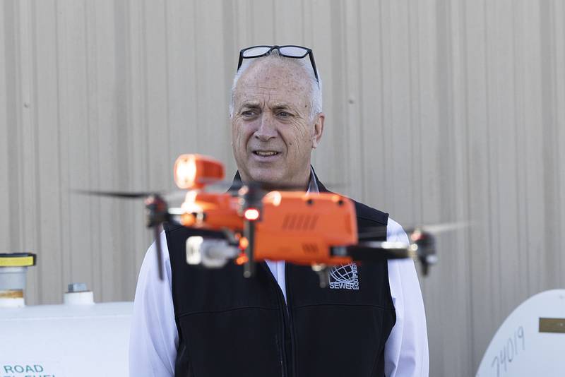 Sewer Equipment president John Wichmann watches as the new drone is taken outside for a flight demonstration fo for the company.