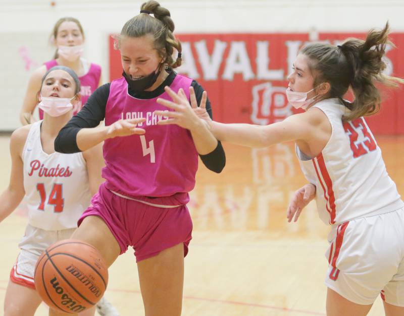 Ottawa's Brooke Waddell (23) jabs the ball free from La Salle-Peru's Brooklyn Ficek (4) on Tuesday Feb. 1, 2022, at L-P. Both Ficek and Waddell were Interstate Eight All-Conference selections.