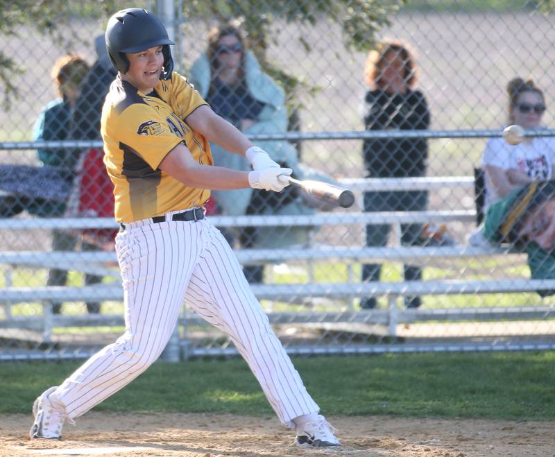 Putnam County's Jaden Stoddard connects with a hit against Woodland/Flanagan-Cornell on Tuesday, April 9, 2024 at Woodland High School.