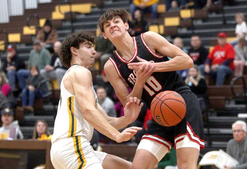 Crystal Lake South’s CJ Regillio, left, pressures  Barrington’s Oliver Gray in Hinkle Holiday Classic boys basketball tournament game action at Jacobs High School Tuesday.