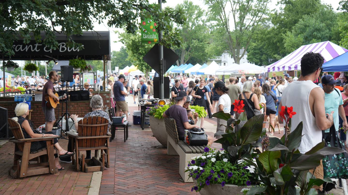 People enjoy the Batavia Farmers' Market on June 29