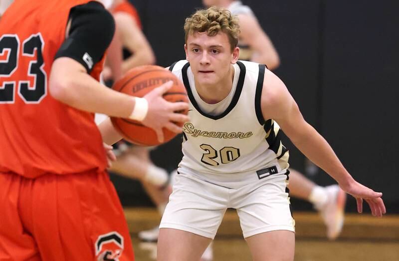 Sycamore's Thatcher Friedrichs plays defense against Sandwich's Chance Lange during their game Friday, Nov. 24, 2023, in the Leland G. Strombom Holiday Tournament at Sycamore High School.