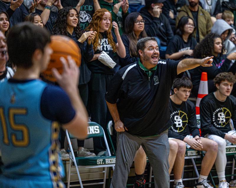 St. Bede Head Coach Brian Hanson yells at team to move on defense whilst Marquette takes the ball out at baseline on Friday, January 16, 2026 at St. Bede Academy in Peru.