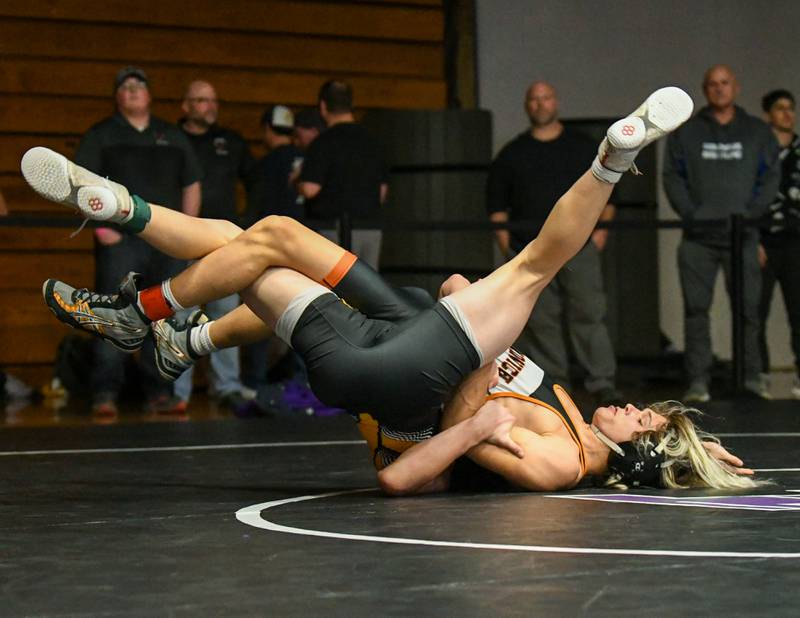 Miles Corder of Sandwich flips around while wrestles during the 138 weight class Saturday Dec. 10th for 3rd place during the Plano Reaper wrestling classic held at Plano High School where he took 4th place.
