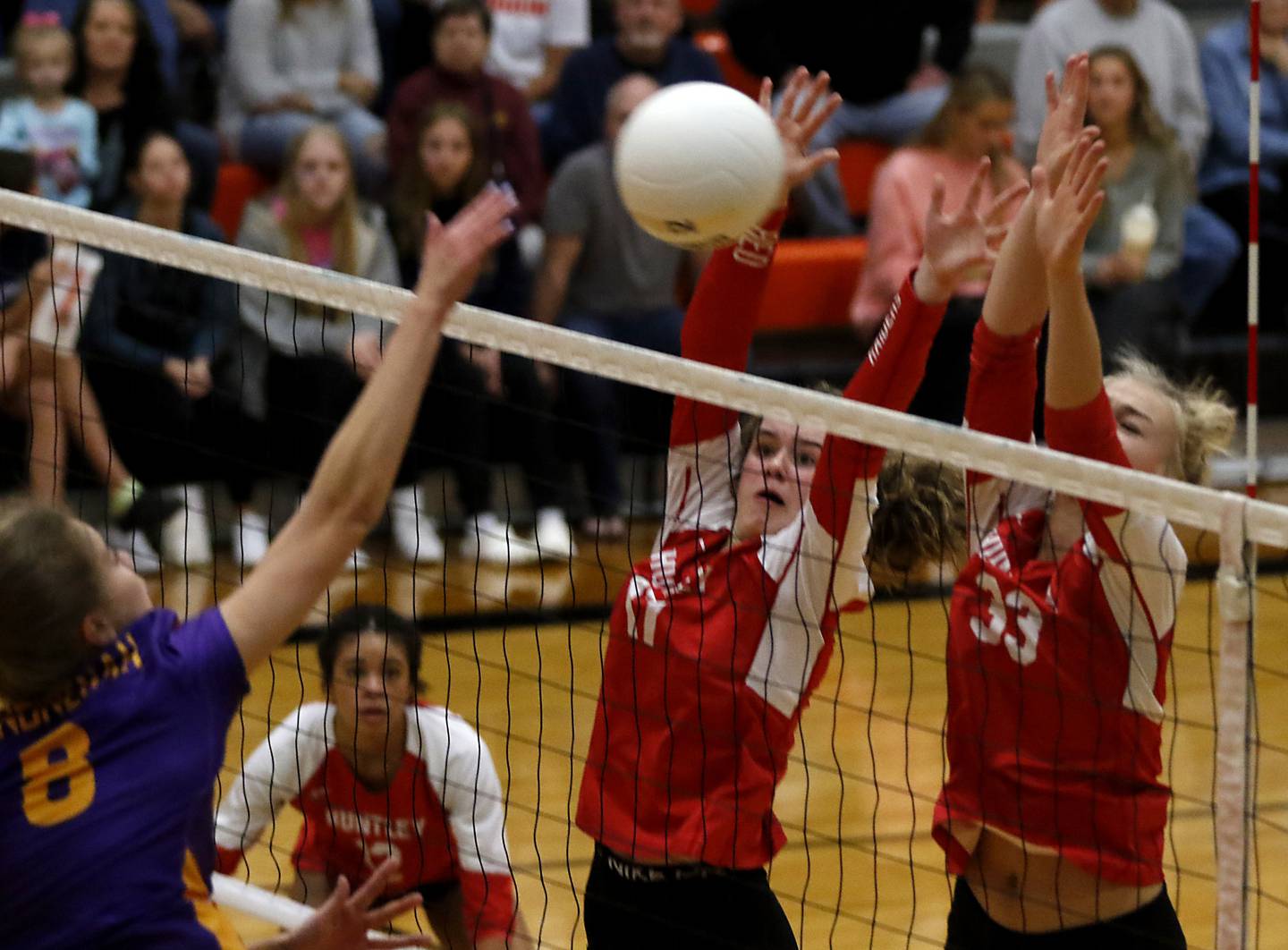 Huntley's Avery Gonzalez, center, and Allyson Panzloff, right, block the hit of Hononegah's Anna Ptacin, left, during the IHSA Class 4A Harlem Sectional Championship volleyball match Wednesday, Nov. 2, 2022, between Huntley and Hononegah at Harlem High School in Machesney Park.