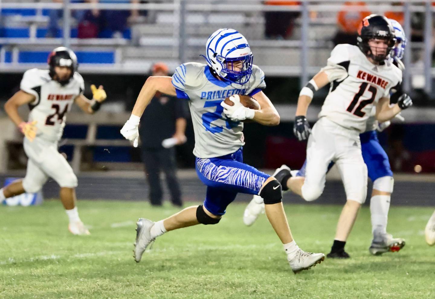 Princeton''s Ayden Agushi races for an 88-yard kickoff return in Friday's game vs. Kewanee at Bryant Field. The Tigers won 63-12.