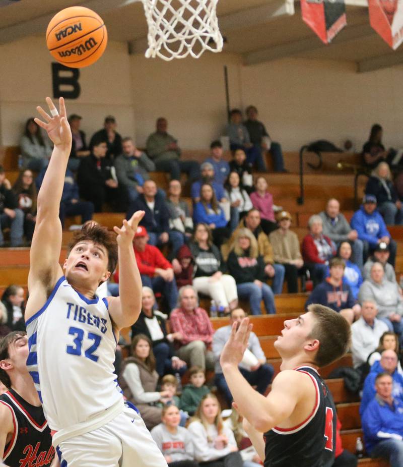 Princeton's Owen Hartman lets go of a shot over Hall's Luke Bryant on Friday, Feb. 13, 2026 at Princeton High School.