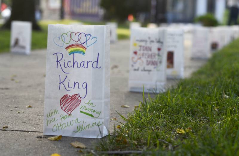 Remembrance luminaries honor members of the LGBTQI+ community and allies who have lost their lives to violence, suicide, AIDS and other causes related to navigating life as a marginalized population during a ceremony Friday, June 9, 2023, at Washington Square in Ottawa.