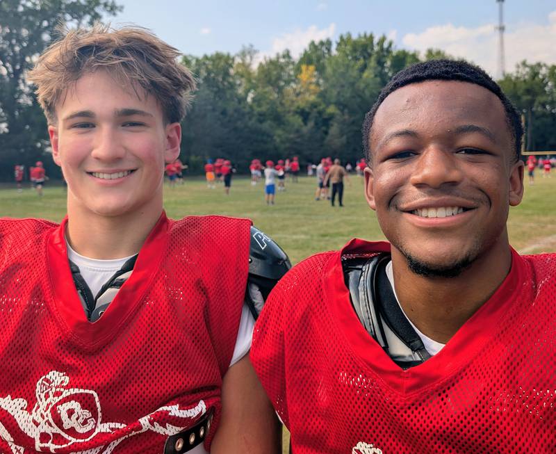 Dundee-Crown junior linebacker/running back Tristan Gatenby (left) and senior running back/defensive back Kadin Malone pose for a photo during practice Thursday, Aug. 14, 2025, at Dundee-Crown in Carpentersville. The two have emerged as leaders for the Chargers.