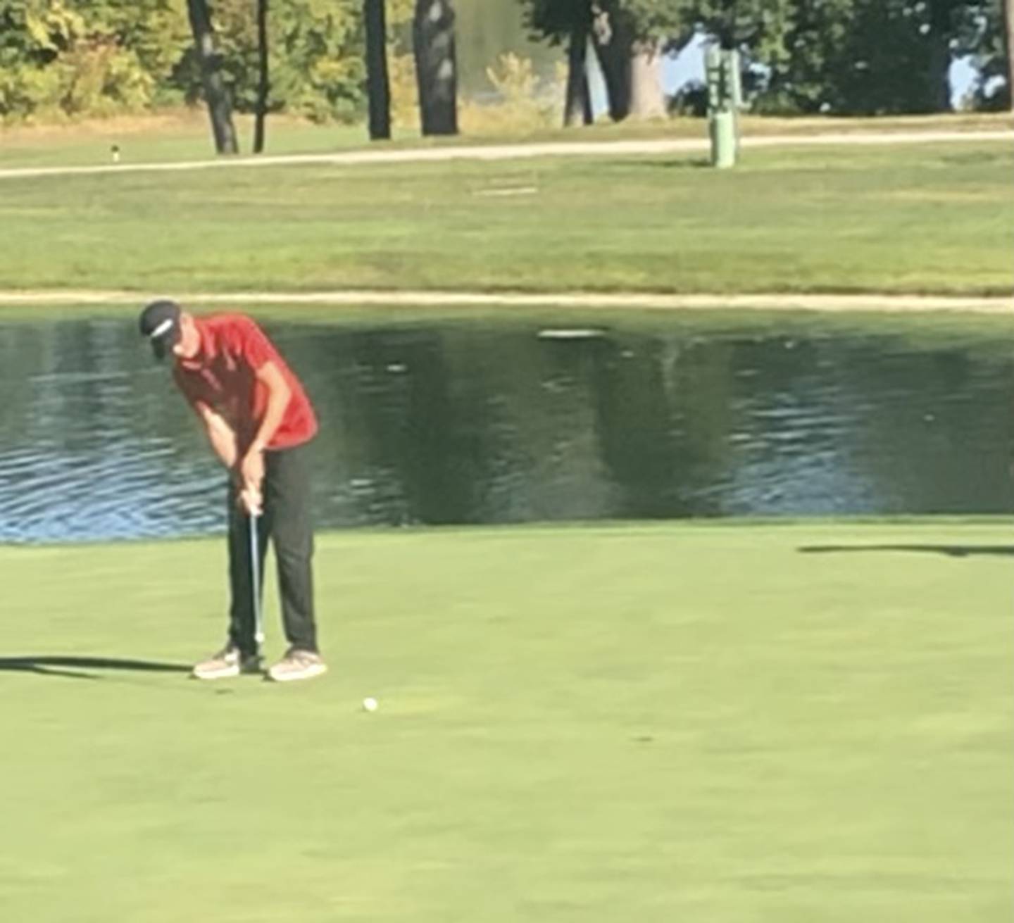 Hall sophomore Landen Plym putts on hole No. 18 in Monday's sectional at TPC John Deere Run in Silvis.