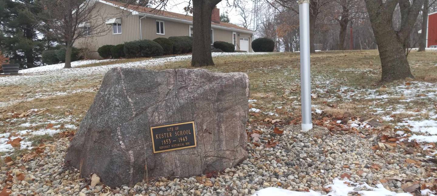 In Neponset township,  section 5 , a plaque celebrating Kuster School 1853 - 1943. Hugo & Mary Ann Block home on same sight he attended school.